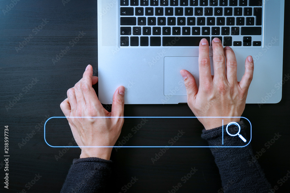 Fototapete cyber security internet and networking concept.Businessman hand working with laptop computer