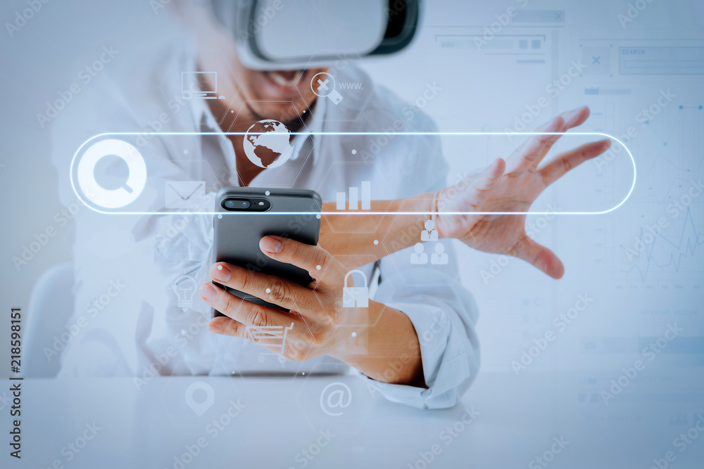Poster businessman wearing virtual reality goggles in modern office with mobile phone using with vr headset