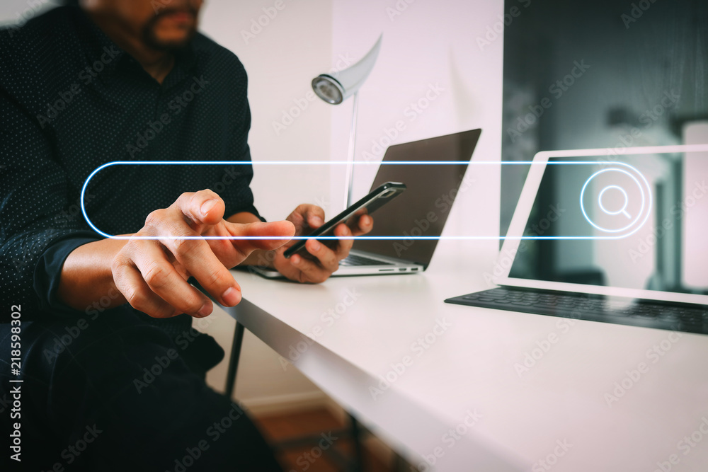 Poster businessman working with smart phone and digital tablet and laptop computer in modern office