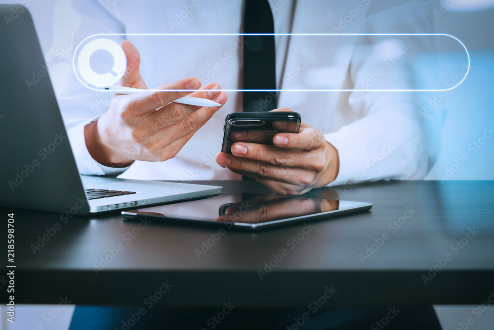 Poster close up of businessman working with smart phone on wooden desk in modern office with virtual icon d