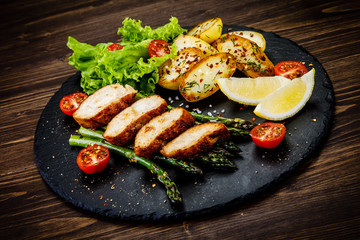 Roast chicken fillets and vegetables