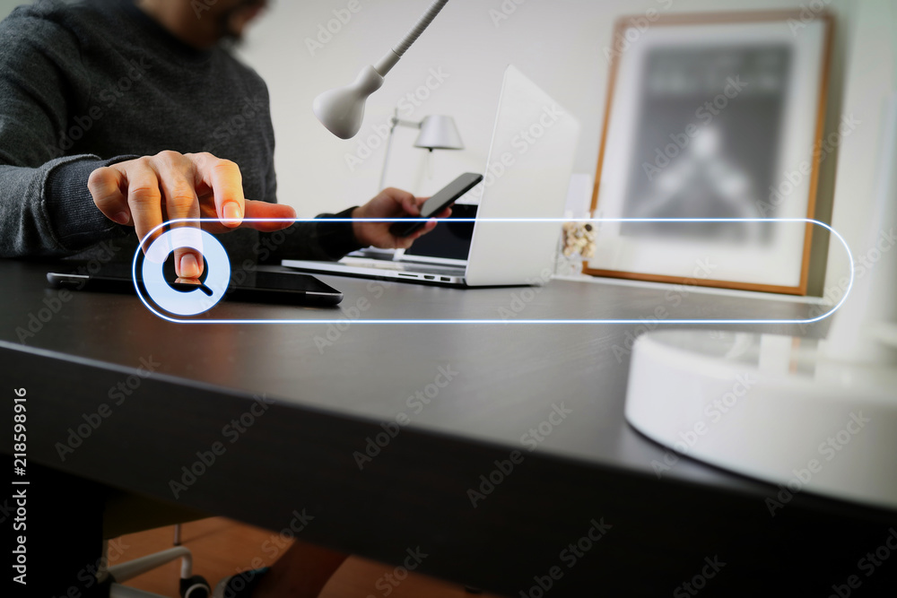 Poster businessman working with smart phone and digital tablet and laptop computer in modern office