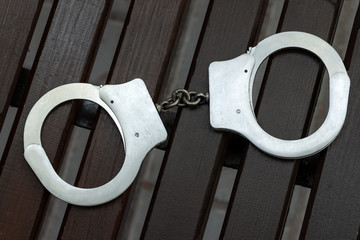 Handcuffs. Enforcement and  punishment. Criminal concept.