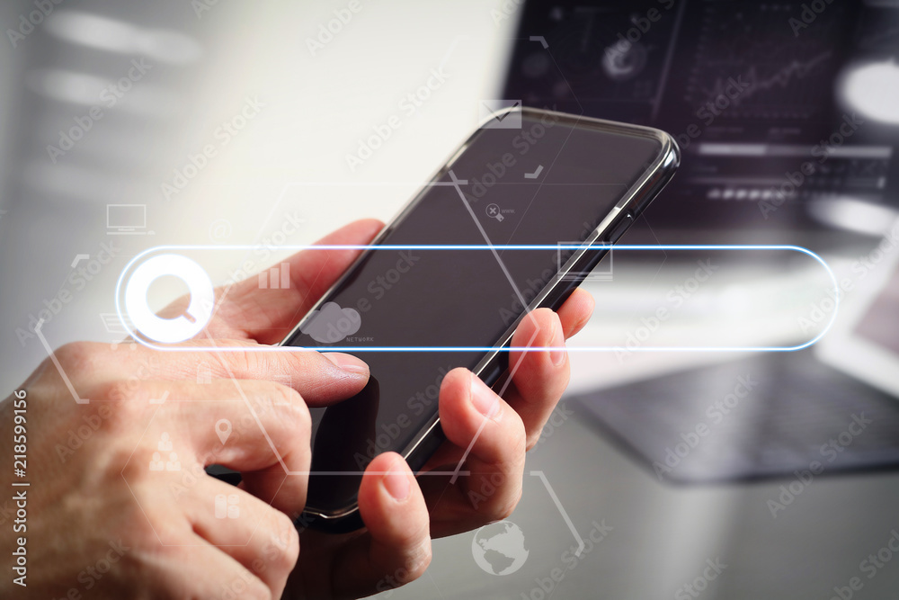 Poster close up of businessman hand working with mobile phone and laptop and digital tablet computer in modern office