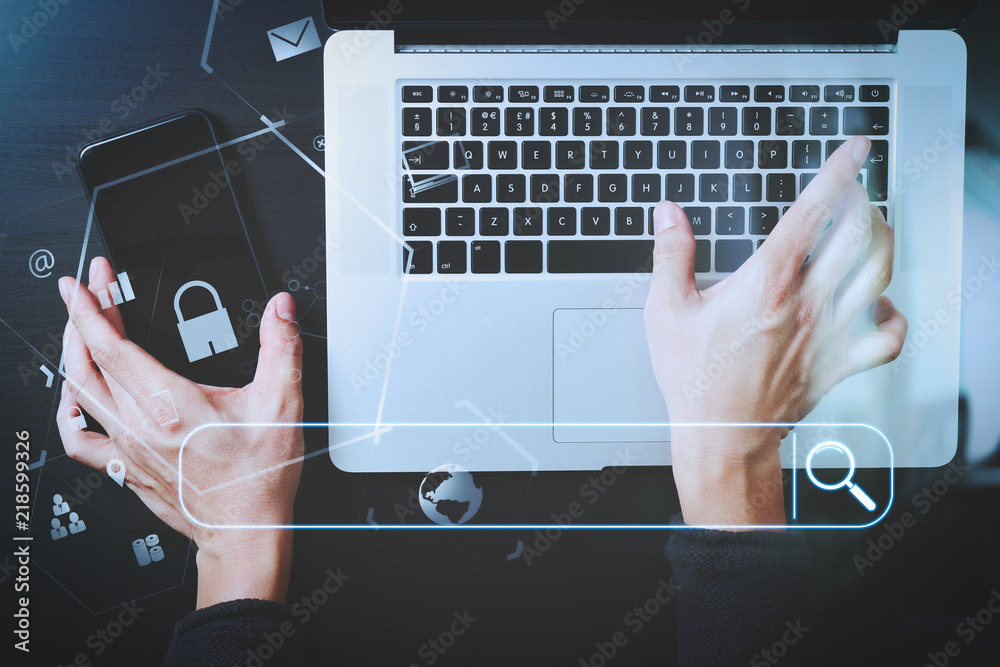 Poster cyber security internet and networking concept.Businessman hand working with VR screen padlock icon mobile phone on laptop computer background