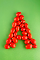 Alphabet 'A' spelt with cherry tomatoes.