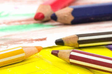 Simple children drawing with color pencil laying, colorful background. Back to school.