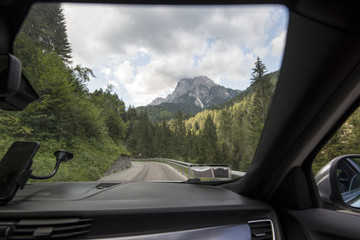 Fototapeta na wymiar View from the car window driving on a road trip