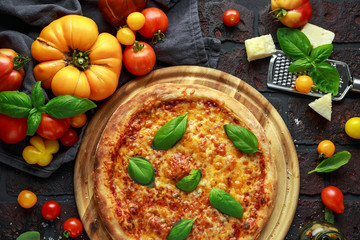 Stone Baked Pizza margherita with farm tomatoes sauce, parmesan and mozzarella cheese, basil