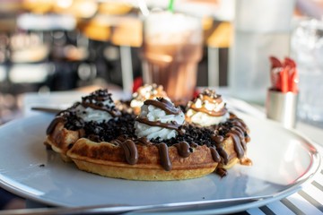 Beautiful photo of a waffle served at a restaurant.