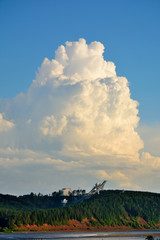 A big cloud and a springboard for ski jumping in Chaikovsky City, Russia