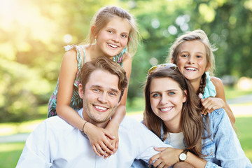 Young family with children having fun in nature