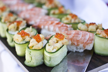 Asian cuisine. Sushi, rolls and sashimi in restaurant