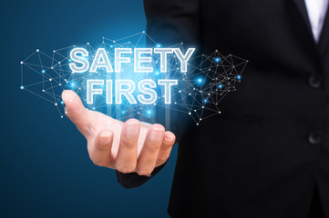 Safety first in the hand of business. Safety first concept