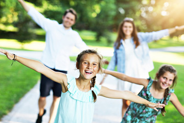 Young family with children having fun in nature