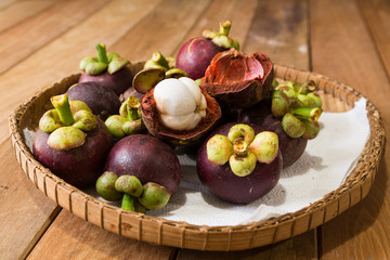Freshly harvested organic mangosteen fruit with thick, juicy, thick flesh.