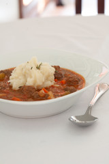 Stew in bowl on table