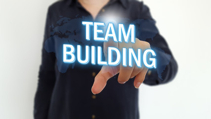 Businesswoman pointing finger on team building text