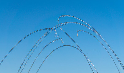 Streams and drops of water on a blue background