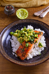 Avocado salmon rice bowl. Salmon fillet roasted in honey, lime, cilantro glaze and fresh cilantro avocado. Fish steak
