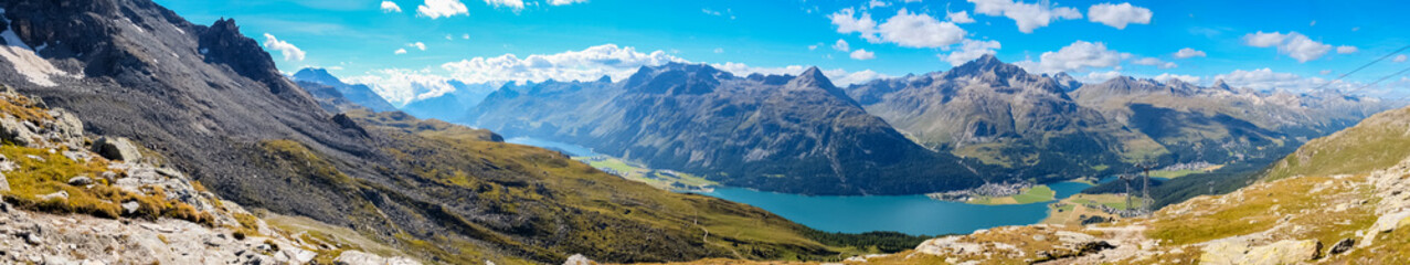 Panorama view over Lake Silvaplana (or Silvaplanersee; Lej da Silvaplauna) in the foreground (Lake Sils is in the background). Lake Silvaplana is a lake in the Upper-Engadine valley of Grisons