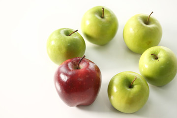 Red apple stand out among green apples