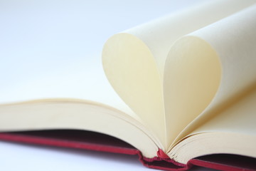 Heart shape formed from pages in book