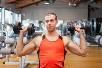 Man Lifting Weights in a Gym