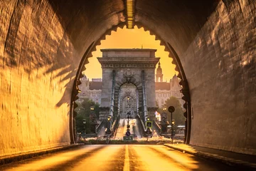 Fotobehang Kettingbrug Budapest, Hungary - Entrance of the Buda Castle Tunnel at sunrise with Szechenyi Chain Bridge and Academy of Science  building at background