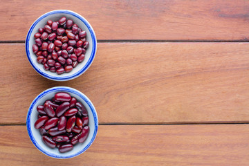two kind  of red beans in bowl on wooden table  with copy space.