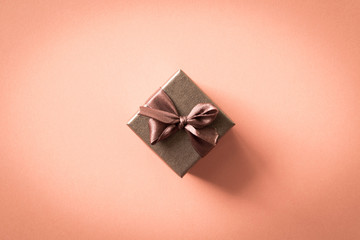 A small gift on a light background. The concept of a gift made with your own hands