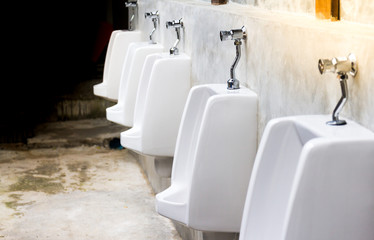 white urinals in men's toilet