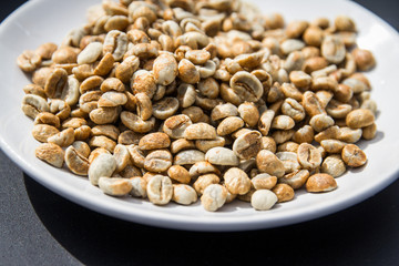 Close up of unroasted coffee beans