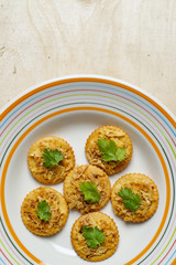 Durian bread crisp in a white dish, placed on the edge of the picture.