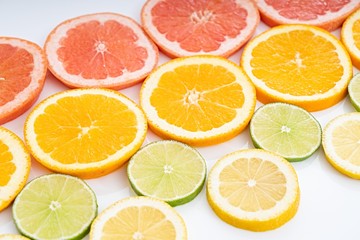 Fototapeta na wymiar oranges ,grapefruit, and other fruits sliced 