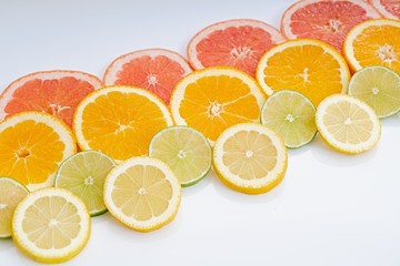Fototapeta na wymiar oranges ,grapefruit, and other fruits sliced 