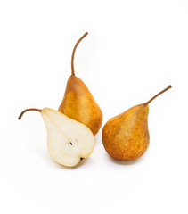 Ripe tasty yellow pears. Two whole pear and half of pear pears with specks on a white background.