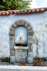 Vintage drinking water fountain in Smartno, Goriska Brda, Slovenia