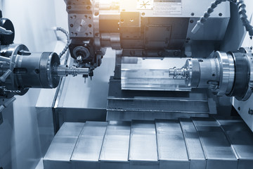 The CNC lathe machine or turning machine cutting the aluminum rod . Hi-technology manufacturing...