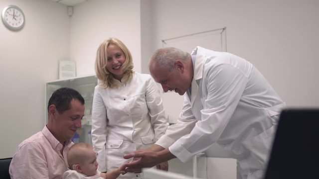 Baby with father in the hospital