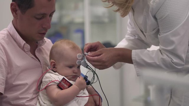 Baby with father in the hospital