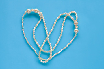 Pearl Necklace on color background.