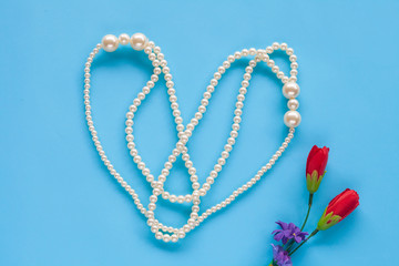 Pearl Necklace on color background.