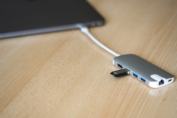 USB adapter with a USB flash drive and Type-C connector installed in a laptop