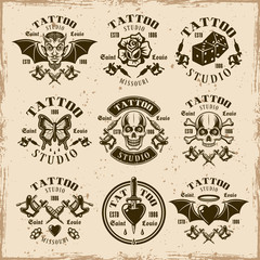 Tattoo studio vector emblems in vintage style
