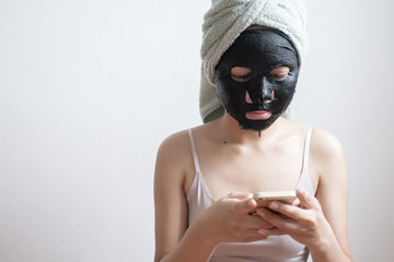 Beautiful woman with Black  facial mask, Lifestyle concept