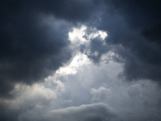 Dramatic sky and thick clouds and light beam.