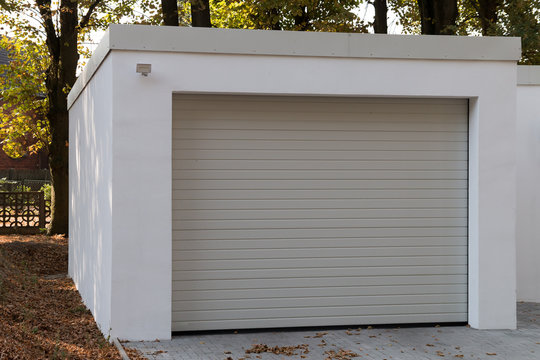 modern new white garage with roller shutter