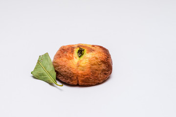 Angled view at old dried out peach isolated on white background. Selective focus on stem.