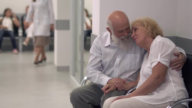 Adult couple in the hall of the hospital